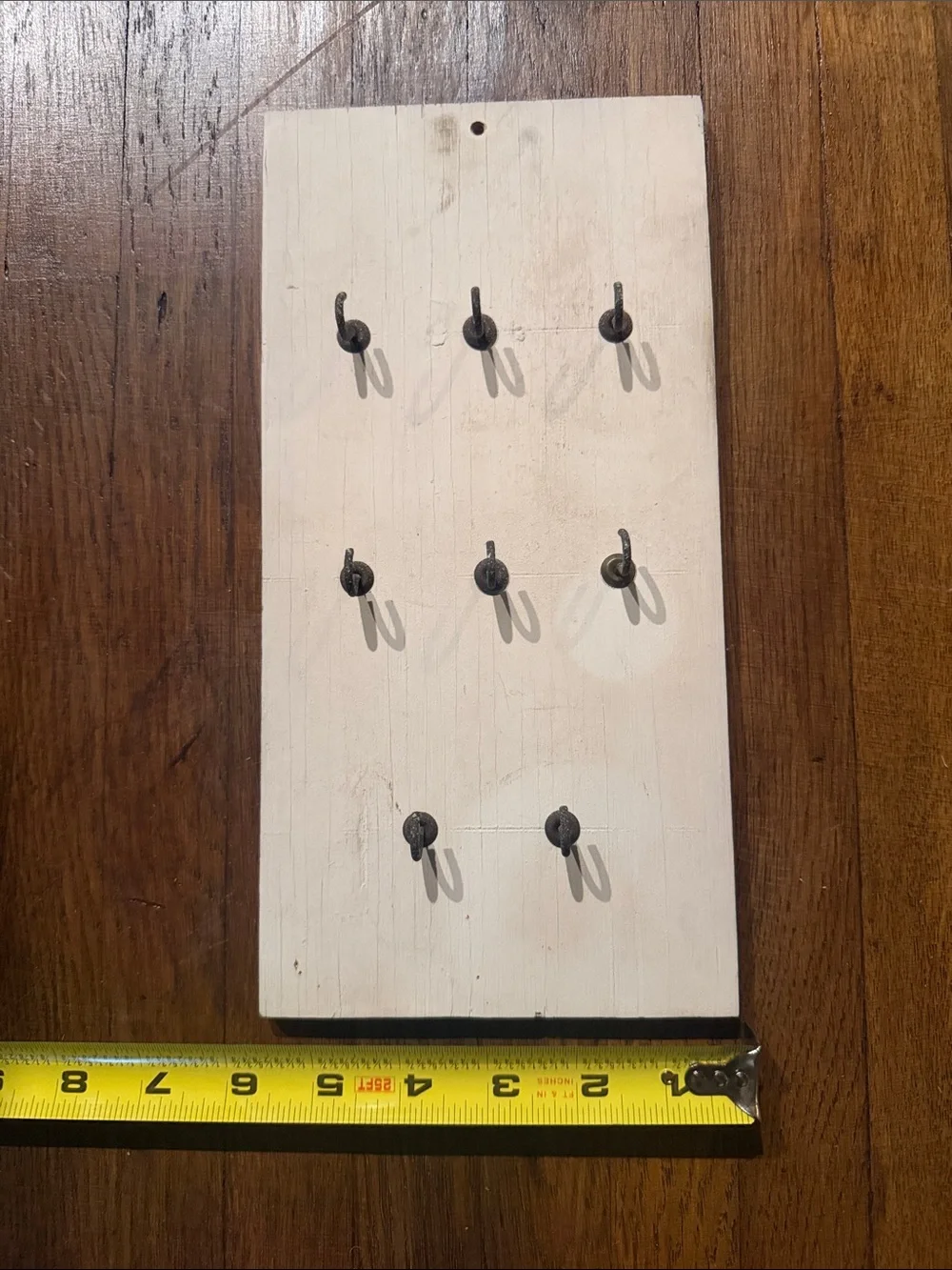 Rustic old worn Wooden Wall Hook Board in Cream with Black Hooks